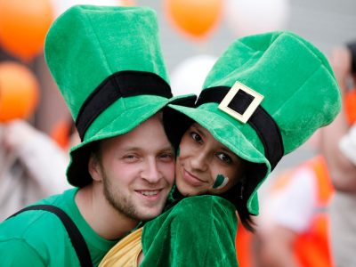 Happy couple portrait St Patrick's day parade in an Irish village.. Adobe RGB