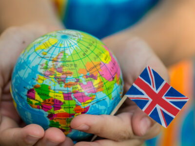 Globe in hand with the UK flag
